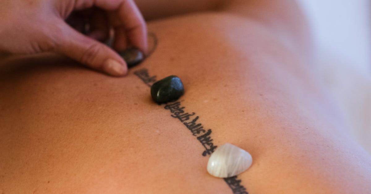 How can you determine the professionalism of a massage therapist based on client reviews and certifications?